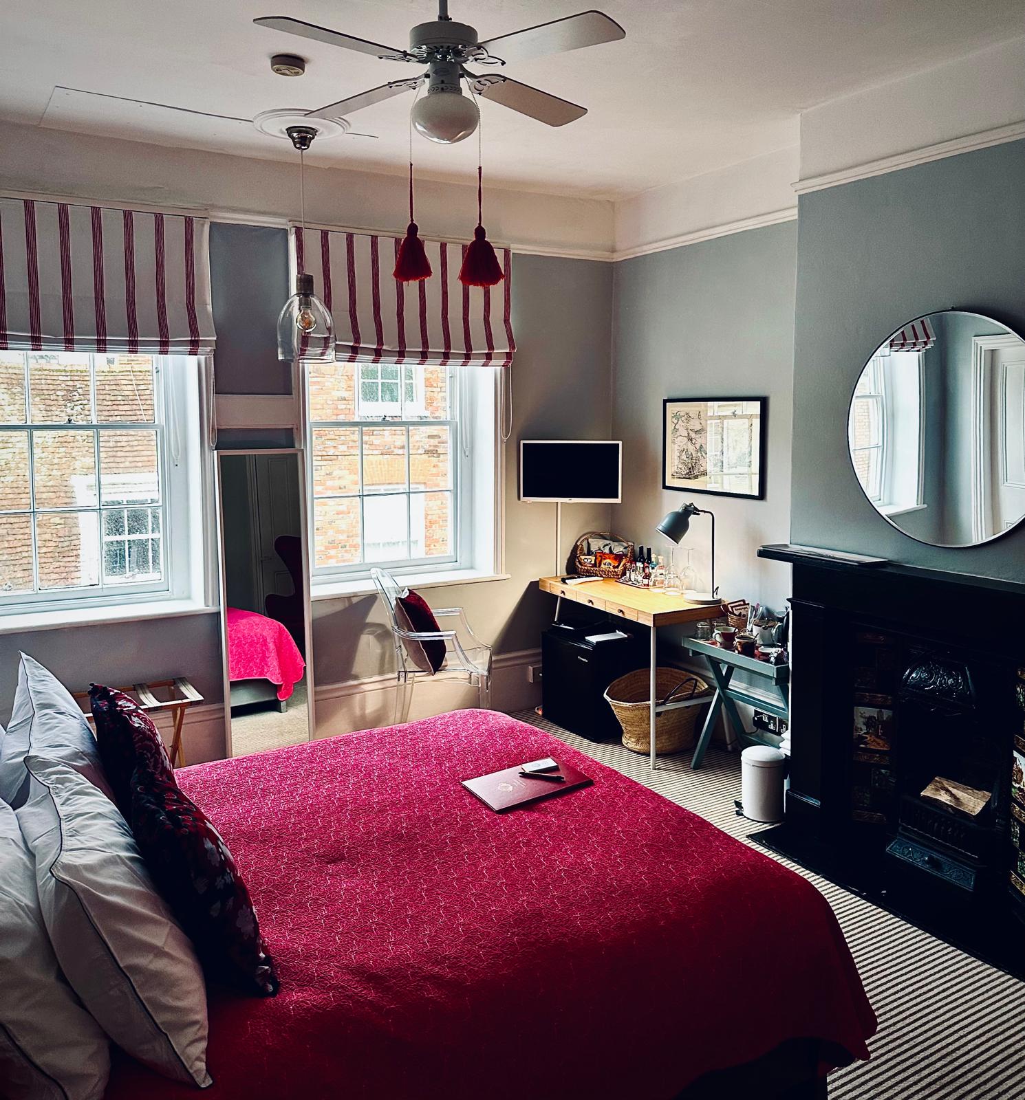 Red room bed with two windows